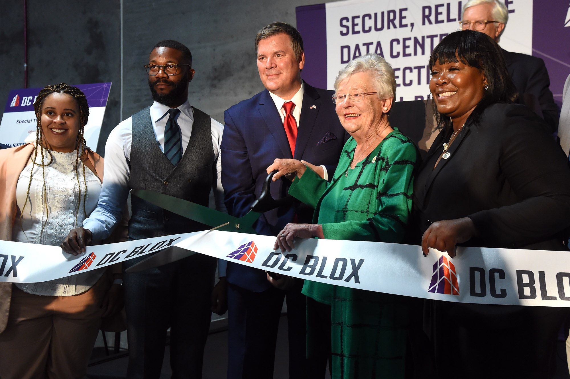 Officials cutting a DC BLOX ribbon at a data center opening