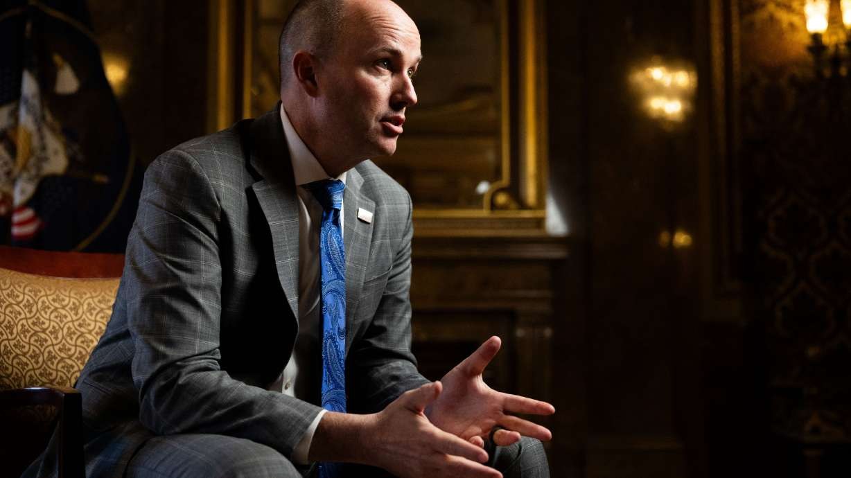 Utah Governor Spencer J. Cox speaking during a sit-down interview in his office
